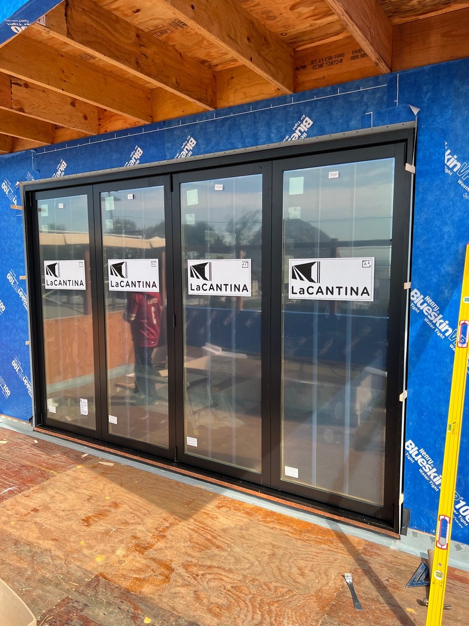 Large LaCantina folding glass door system installed in a new framed opening